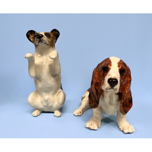 23 - Two large Jenny Winstanley pottery figures of dogs, a Bassett Hound and a Jack Russell, with factory... 