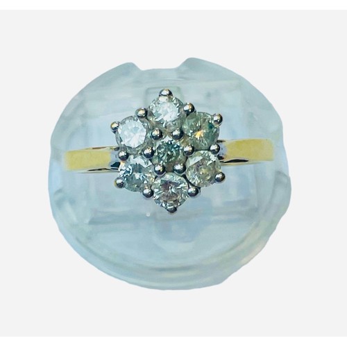 141 - An 18ct yellow gold dress ring, set with 7 x round diamonds in a cluster design, total diamond weigh... 