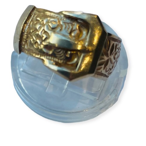 166 - A 9ct gold buckle ring, with engraved design, weighs 8.3 grams, 10mm in width. size N1/2