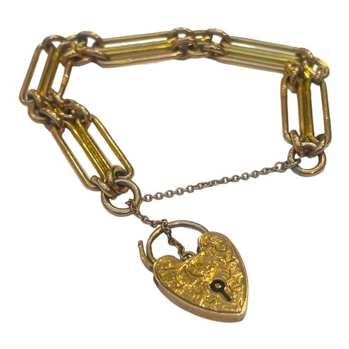 175 - A 9ct yellow gold double elongated link bracelet, with heart shaped lock, weighing 25.8 grams.