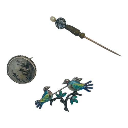 177 - Three various brooches, including a silver enamel bird brooch, a round moss-agate brooch, and a diam... 