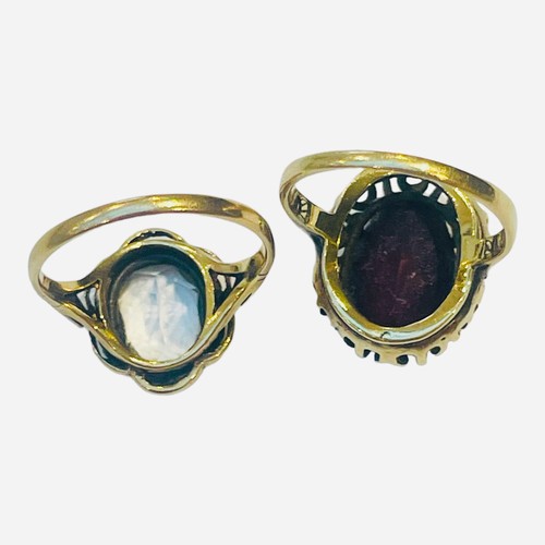 182 - A 9ct gold garnet dress ring, and a 9ct gold ring set with a clear stone, total weight 6.6 grams.