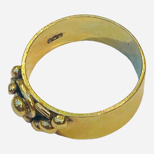 183 - A 9ct gold wide band ring, with gold bead decoration, together with a 9ct gold disc pendant, cast wi... 