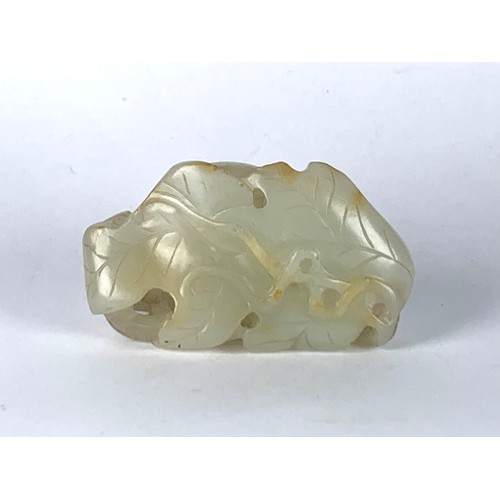 66 - A Chinese Qing Dynasty pale celadon jade 'Squirrel and Grapevine' pendant, realistically carved with... 