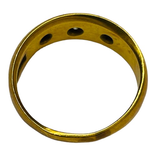 187 - An 18ct gold dress ring, gypsy-set with three small diamonds, weighing 4.0 grams.