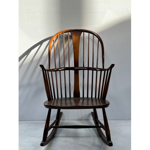 508 - An Ercol dark elm double-bow-back Chairmaker's Windsor rocking-chair, blue label to back of seat, ap... 