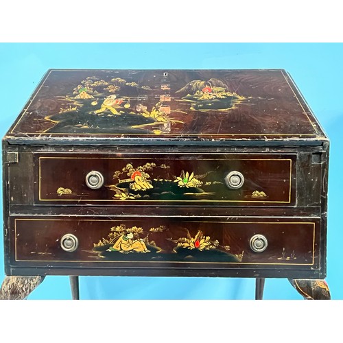 507 - A Chinioserie lacquered bureau, the fall front and two graduated long drawers with gilt decoration a... 