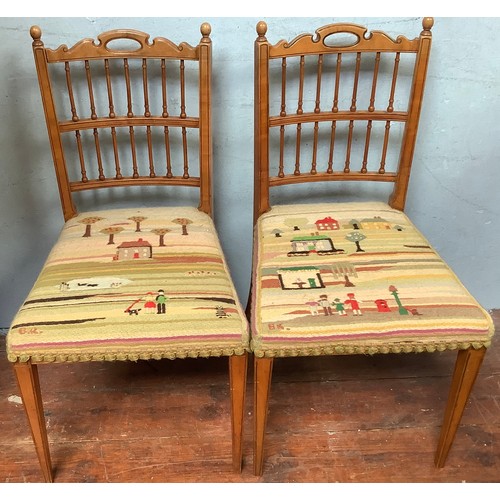 506 - A pair of walnut spindle back dining chairs by Gillows, stamped, with pastel coloured knitted seat c... 