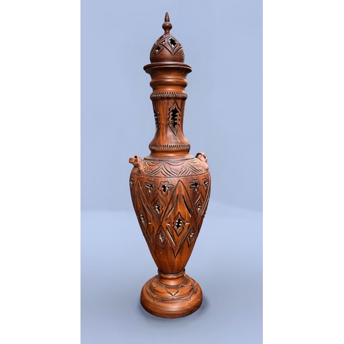 46 - A large terracotta Orientalist style urn/vase, of inverted baluster form, with pierced and worked si... 