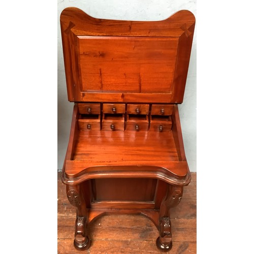 513 - A reproduction Victorian style mahogany Davenport, of typical form, with hinged, raised back enclosi... 