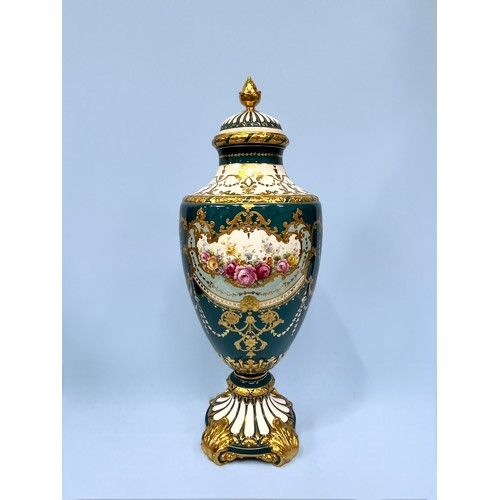 55 - A large Royal Bonn printed porcelain urn and cover, central panel of floral design, painted blue and... 