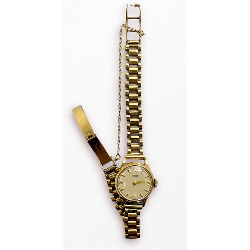 119 - A ladies 9ct gold cased Tissot wristwatch, the silvered dial with batons denoting hours and Arabic n... 