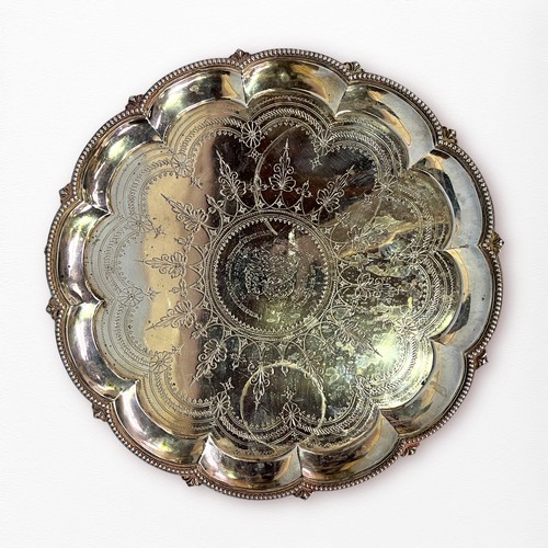 91 - A shaped, circular silver salver by Walter & John Barnard, presented to Lady Ethel Wickham on her ma... 