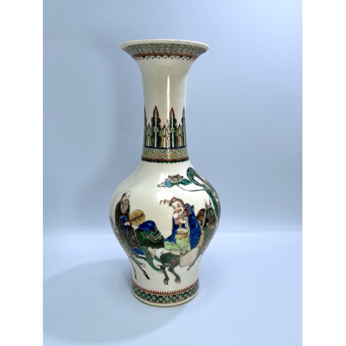 63 - A 'Wanli' Qing Dynasty porcelain Wucai vase, of baluster form with flared rim, incised and painted w... 