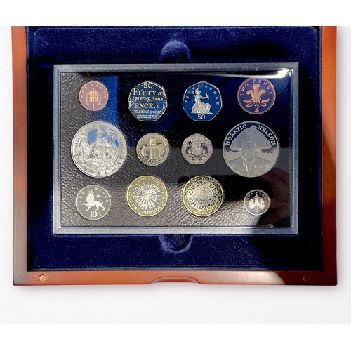 239 - A 2005 UK Executive Proof 12-Coin Set, and a 2016 Commemorative Proof 9-Coin Set, both with booklets... 