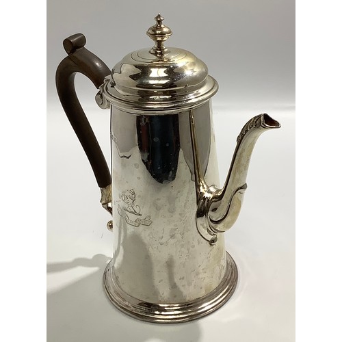 90 - A silver coffee pot by Marples & Co. Of cylindrical tapering form, with crest to one side and engrav... 