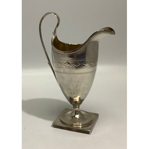 96 - A George III silver small ewer by Duncan Urquhart & Naphtali Hart, with gilt interior, raised on squ... 