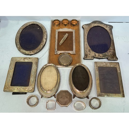 102 - Six various silver photo frames by Walker and Hall, to include, a pair of oval form photo frames wit... 