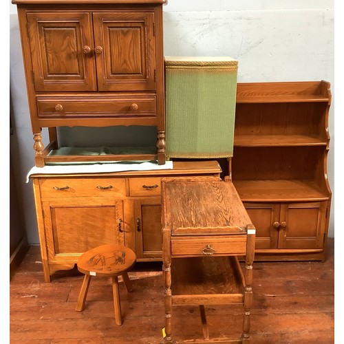 514 - An Ercol Golden Dawn 'Crendance Cupboard'  and matching 'Waterfall Bookcase' together with an oak tw... 