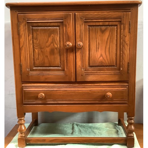 514 - An Ercol Golden Dawn 'Crendance Cupboard'  and matching 'Waterfall Bookcase' together with an oak tw... 