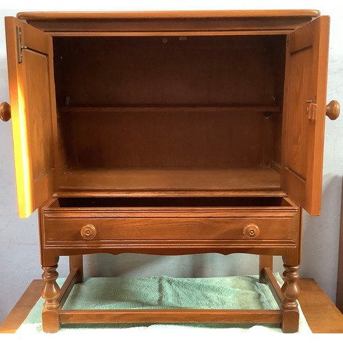 514 - An Ercol Golden Dawn 'Crendance Cupboard'  and matching 'Waterfall Bookcase' together with an oak tw... 