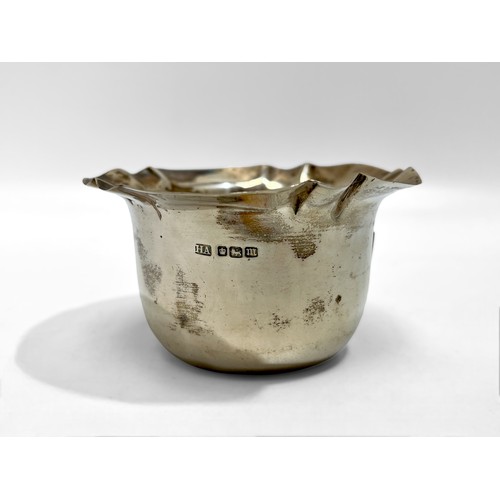 83 - A silver sauce boat by Adie Brothers, hallmarked Birmingham, 1961 and a silver ashtray, together wit... 