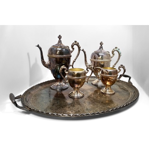 86 - A four-piece silver-plated teaset, of ovoid form raised on spreading circular foot, foliate finials,... 