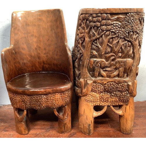 515 - An African carved solid wooden table and four chairs, probably Acacia wood, the solid chairs and tab... 