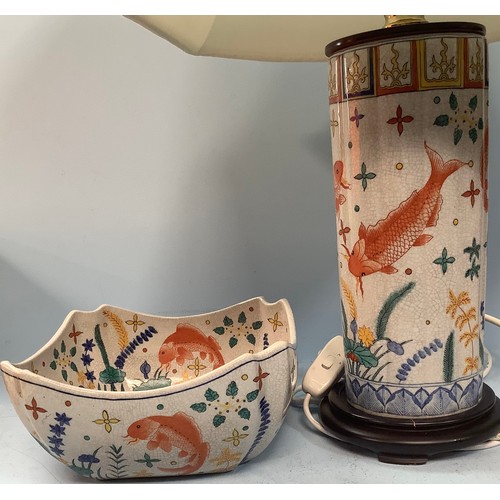 409 - A painted cylindrical lamp, modelled as a converted Oriental vase, decorated with Koi and pond plant... 