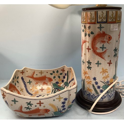 409 - A painted cylindrical lamp, modelled as a converted Oriental vase, decorated with Koi and pond plant... 