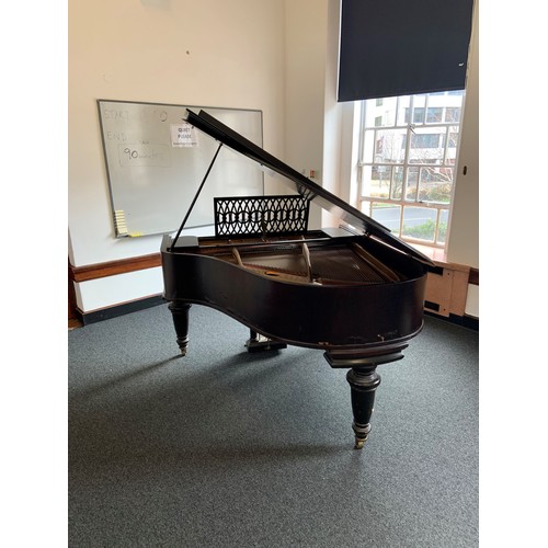 416 - A Broadwood mahogany grand piano, serial number 50180, with music rest and raised on brass castors. ... 