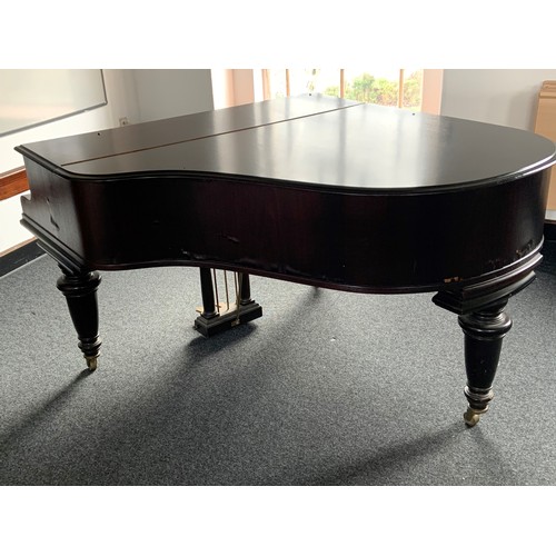 416 - A Broadwood mahogany grand piano, serial number 50180, with music rest and raised on brass castors. ... 