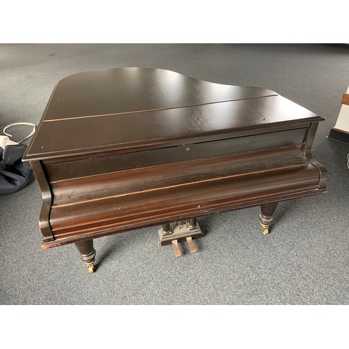 416 - A Broadwood mahogany grand piano, serial number 50180, with music rest and raised on brass castors. ... 