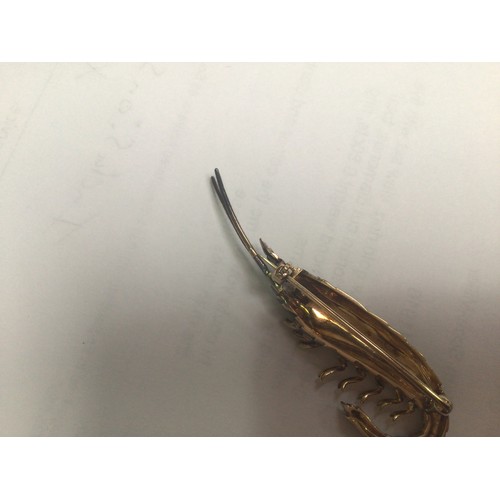 196 - An antique gold and silver brooch modelled as a shrimp, the body and tail set with approximately 56 ... 