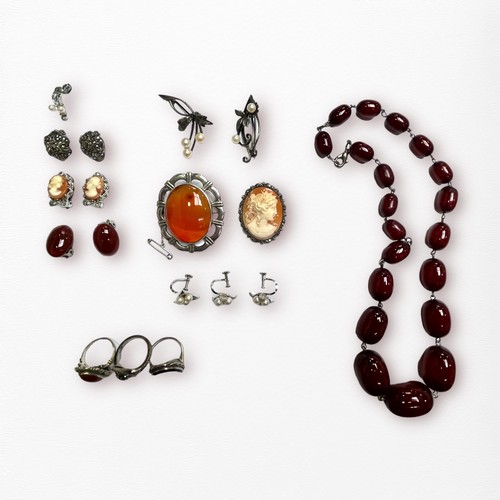 178 - A set of dark amber beads, together with various silver brooches and rings etc.