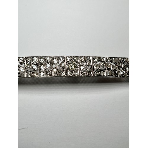 146 - A 15ct and 18ct white gold Art Deco bracelet, 20 x articulated rectangular panels, set with various ... 