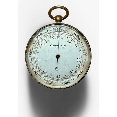 523 - A late Victorian gilt brass dual-sided pocket aneroid baromter with mecury thermometer and compass, ... 