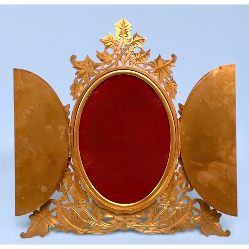 293 - A 19th century gilt-brass picture frame, pierced foliate decoration surrounding two hinged doors, em... 