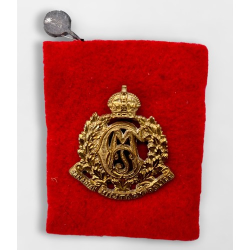 512 - Seven various military cap and shoulder badges including Canada Military Police, Kings Own Malta Reg... 