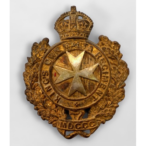 512 - Seven various military cap and shoulder badges including Canada Military Police, Kings Own Malta Reg... 