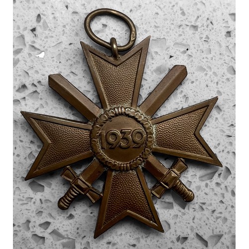 565 - A German Third Reich 'Cross of Honour of The German Mother' First Class badge, gilt bronze and ename... 