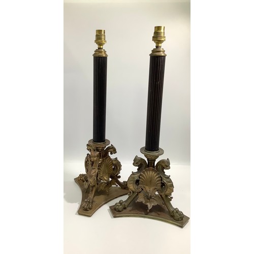 69 - A pair of early 20th Century Elkington Baroque style table lamps, modelled as fluted black columns t... 