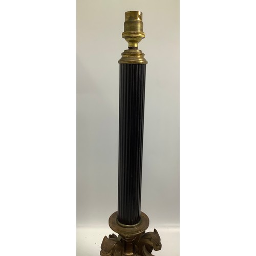 69 - A pair of early 20th Century Elkington Baroque style table lamps, modelled as fluted black columns t... 