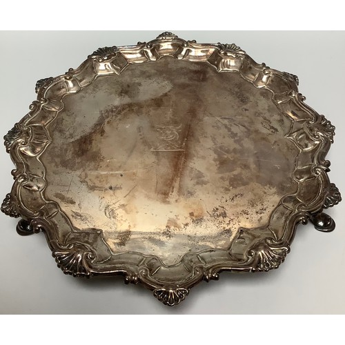 70 - A small George III silver salver by Richard Rugg I, with srpentine and shell border, bull crest to c... 