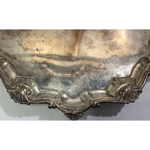 70 - A small George III silver salver by Richard Rugg I, with srpentine and shell border, bull crest to c... 