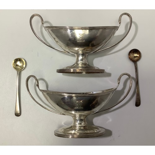 74 - A matched pair of Victorian silver salts by William Hutton & Sons, of oval/trophy form with with twi... 