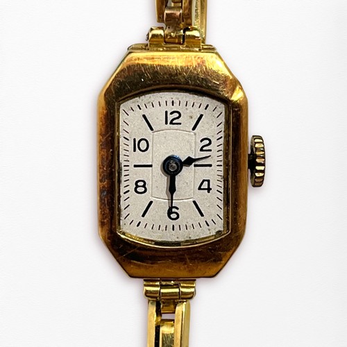 114 - An 18ct gold cased ladies wristwatch, the silvered dial with batons and Arabic numerals denoting hou... 