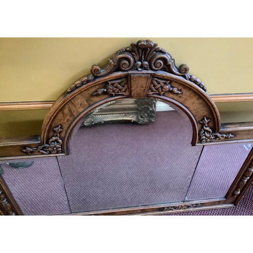 388 - A 19th century oak overmantle mirror, possibly previously the back to a sideboard, with central arch... 