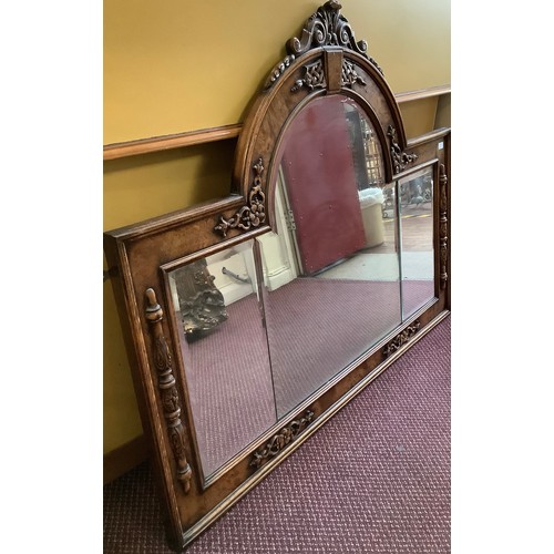 388 - A 19th century oak overmantle mirror, possibly previously the back to a sideboard, with central arch... 