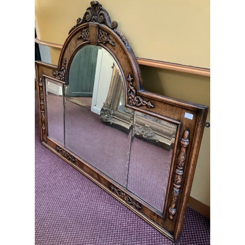 388 - A 19th century oak overmantle mirror, possibly previously the back to a sideboard, with central arch... 